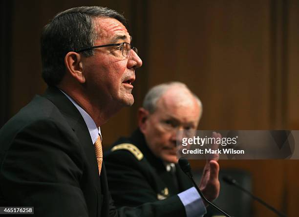 Defense Secretary Ashton Carter testifies while Chairman of the Joint Chiefs of Staff Army Gen. Martin Dempsey listens during a Senate Armed Services...