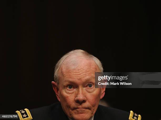 Joint Chiefs of Staff, Army Gen. Martin Dempsey listens to questions during a Senate Armed Services Committee hearing on Capitol Hill March 3, 2015...