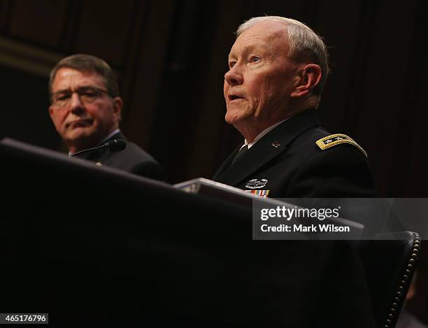 Joint Chiefs of Staff, Army Gen. Martin Dempsey testifies while Defense Secretary Ashton Carter listens during a Senate Armed Services Committee...