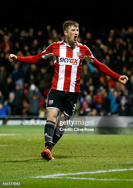 Chris Long of Brentford celebrates his second goal during the Sky Bet Championship match between Brentford and Huddersfield Town at Griffin Park on...