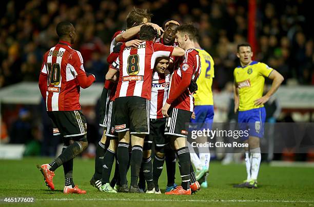 Alex Pritchard of Brentford celebrates his goall during the Sky Bet Championship match between Brentford and Huddersfield Town at Griffin Park on...