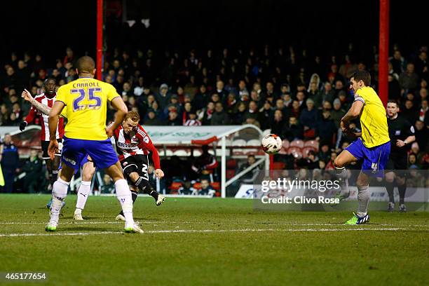 Alex Pritchard of Brentford scores a goal during the Sky Bet Championship match between Brentford and Huddersfield Town at Griffin Park on March 3,...