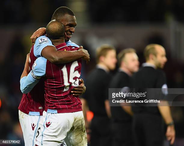 Christian Benteke of Aston Villa celebrates scoring their second goal from the penalty spot with Fabian Delph during the Barclays Premier League...