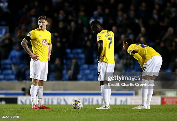 Derby players Jeff Hendrick, Simon Dawkins and Kwame Thomas look dejected after conceding a second goal during the Sky Bet Championship match between...