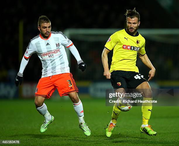 Marco Motta of Watford holds off Kostas Stafylidis of Fulham during the Sky Bet Championship match between Watford and Fulham at Vicarage Road on...