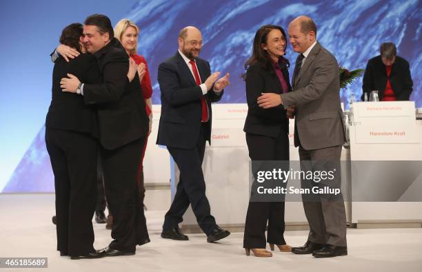 Sigmar Gabriel , German Vice Chancellor and Chairman of the German Social Democrats , embraces outgoing SPD General Secretary Andrea Nahles as Olaf...