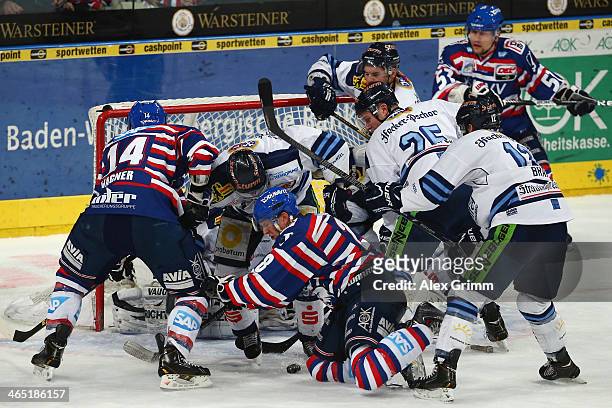 Frank Mauer of Mannheim tries to score during the DEL match between Adler Mannheim and Straubing Tigers at SAP Arena on January 26, 2014 in Mannheim,...
