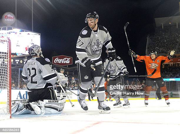 Teemu Selanne of the Anaheim Ducks reacts to a Nick Bonino goal in front of Jonathan Quick and Jeff Carter of the Los Angeles Kings during the 2014...
