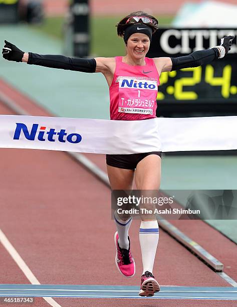 Tetiana Gamera-Shmyrko of Ukraine crosses the finishing line to win in the 33rd Osaka Women's Marathon at Nagai Stadium on January 26, 2014 in Osaka,...