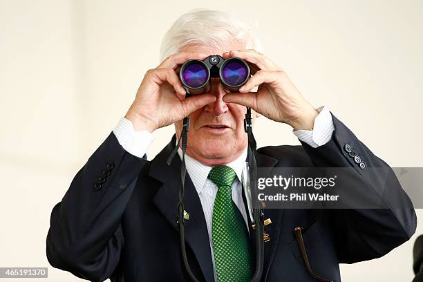 Sir Patrick Hogan watches the racing during Auckland Cup Day at Ellerslie Racecourse on March 4, 2015 in Auckland, New Zealand.