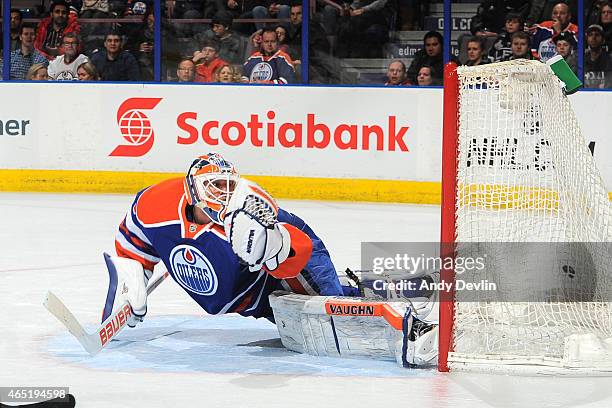 Ben Scrivens of the Edmonton Oilers looks back as the puck goes past him during the game against the Los Angeles Kings on March 3, 2015 at Rexall...