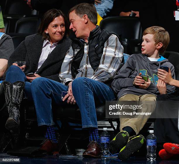 Governor of Colorado John Hickenlooper attends the Denver Nuggets game against the Milwaukee Bucks along with girlfriend Robin Pringle and his son...