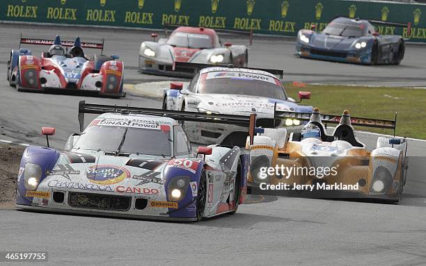 The Huighway To Help Riley DP driven by Byron DeFoor, Jim Pace, Frank Beck and David Hinton leads a group of cars during the ROLEX 24 at Daytona...