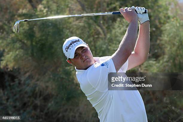 Jason Kokrak hits a tee shot on the 17th hole on theJack Nicklaus Private Course at PGA West during the first round of the Humana Challenge in...