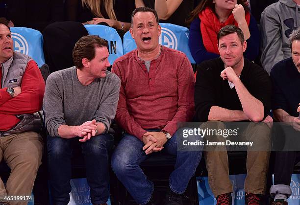 Tom Hanks and Ed Burns attend the Sacramento Kings vs New York Knicks game at Madison Square Garden on March 3, 2015 in New York City.