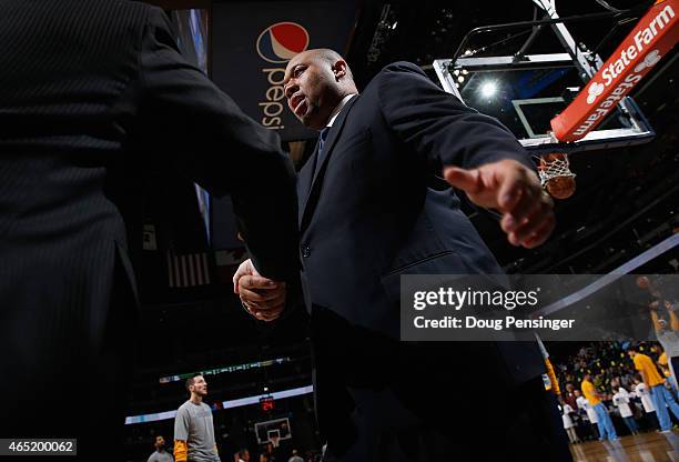 Interim head coach Melvin Hunt of the Denver Nuggets takes the court to lead the Nuggets against the Milwaukee Bucks at Pepsi Center on March 3, 2015...