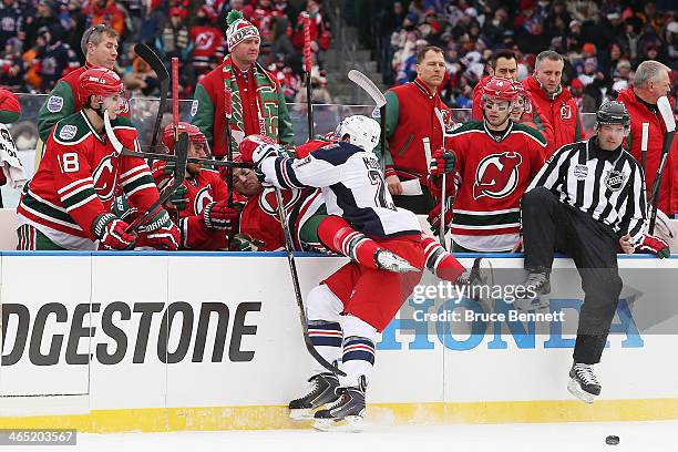 Ryan McDonagh of the New York Rangers checks Travis Zajac of the New Jersey Devils in the first period during the 2014 Coors Light NHL Stadium Series...