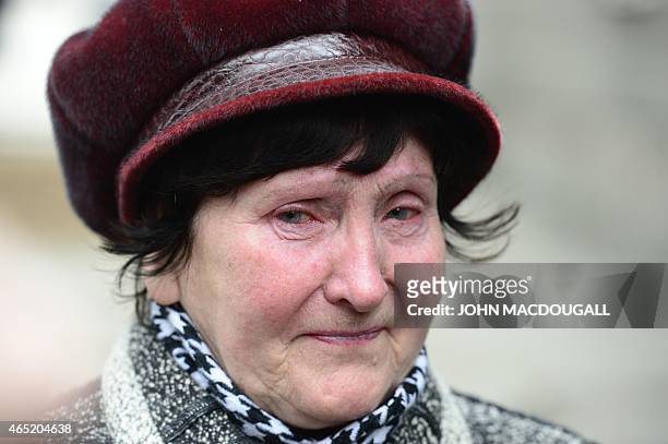Valentina Dzuba mother of a miner, cries outside the Zasyadko mine in Donetsk after the mine was rocked by an explosion on March 4, 2015. At least 32...