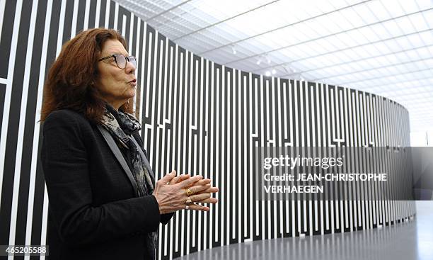 French artist Tania Mouraud poses in front of "MDQRPV?" 2015 on March 2, 2015 at the Pompidou Center-Metz in the eastern city of Metz, two days...