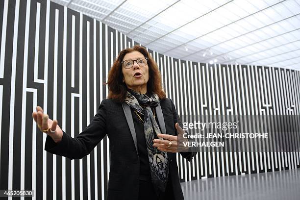 French artist Tania Mouraud speaks in front of "MDQRPV?" 2015 on March 2, 2015 at the Pompidou Center-Metz in the eastern city of Metz, two days...