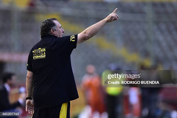 Ecuador's Barcelona coach Ruben Israel gesture during their Copa Libertadores football match against Paraguay's Libertad at Monumental stadium in...