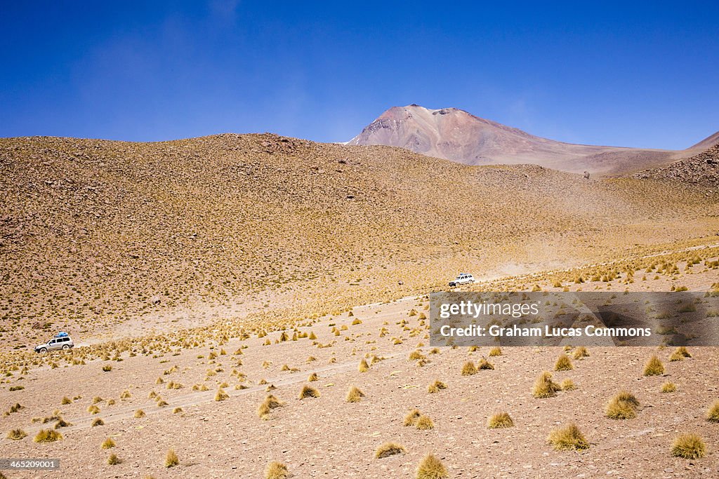 4x4 vehicles cross the Salar de Uyuni Desert