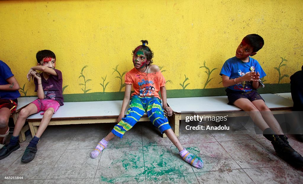 Physically handicapped children celebrate Holi festival in India