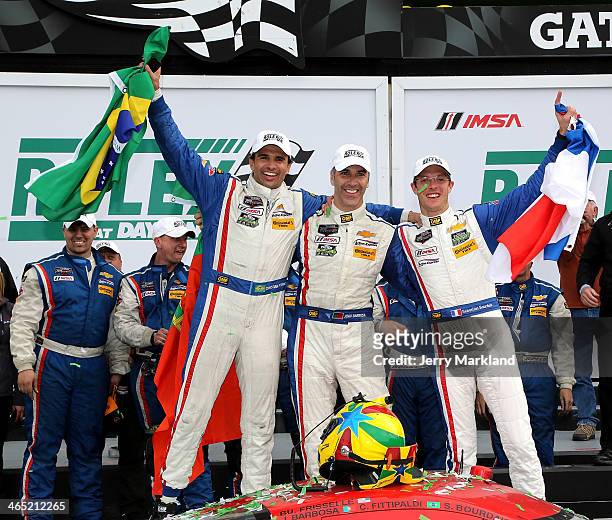 Christian Fittipaldi, Joao Barbosa and Sebastien Bourdais drivers of the Action Express Racing Corvette DP celebrate on the podium after winning the...