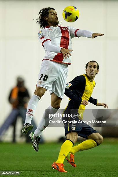 Joaquin Larrivey of Rayo Vallecano de Madrid wins the header after Diego Godin of Atletico de Madrid during the La Liga match between Rayo Vallecano...