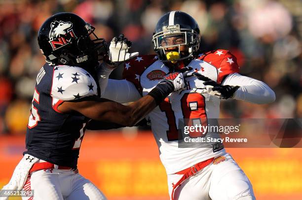 Lavelle Westbrooks of the South squad works against Jimmie Ward of the North squad during the Reese's Senior Bowl at Ladd Peebles Stadium on January...