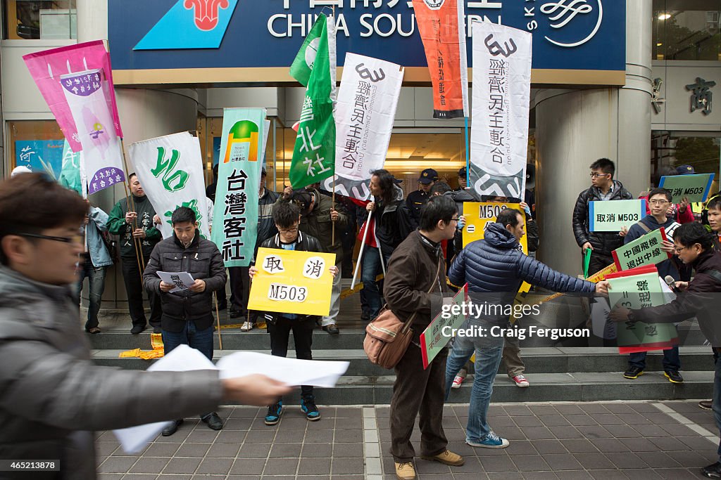 Activists hand out information regarding a protest over...