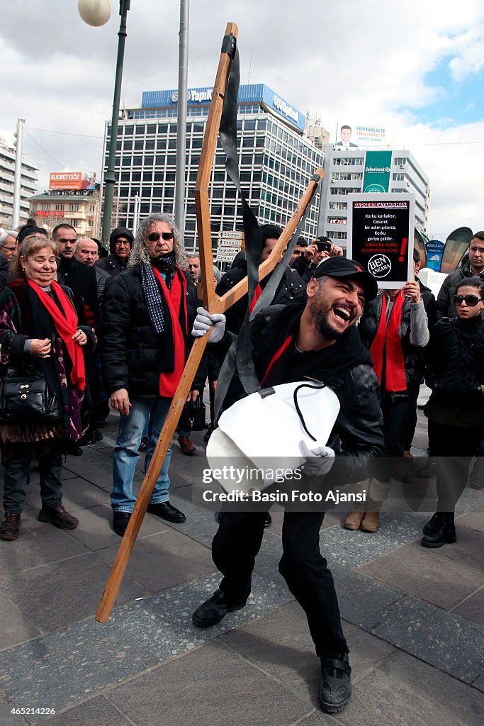 A demonstrator uses  a model sling, police prevented...