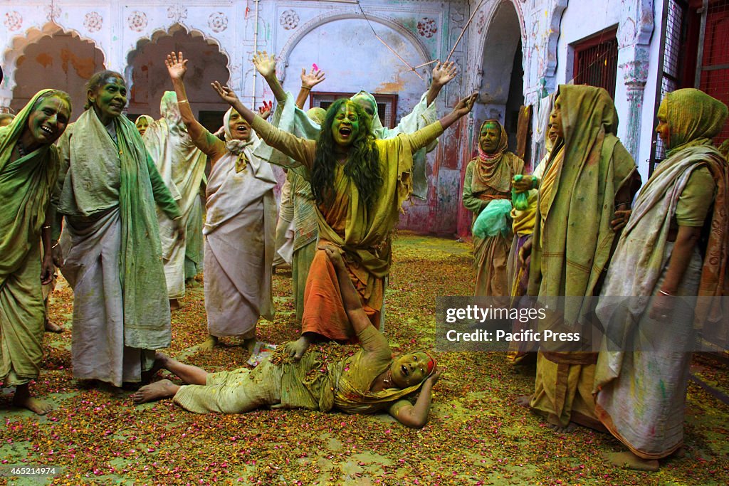 Widows throwing the 'Gulal' (Colored Powder) together,...