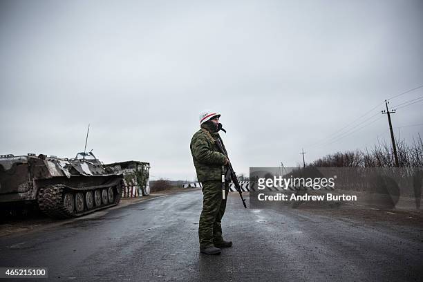 Pro-Russian seperatist stands guard at a check point on the road heading to Mariupol on March 4, 2015 in Novoazovsk, Ukraine. Novoazovsk lies east of...