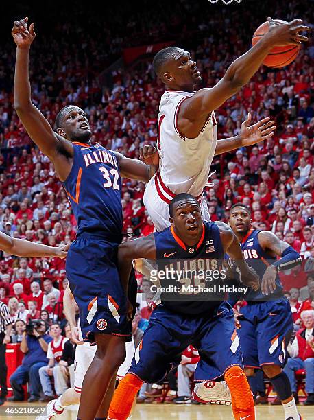 Noah Vonleh of the Indiana Hoosiers reaches for a rebound over the back of Kendrick Nunn of the Illinois Fighting Illini at Assembly Hall on January...
