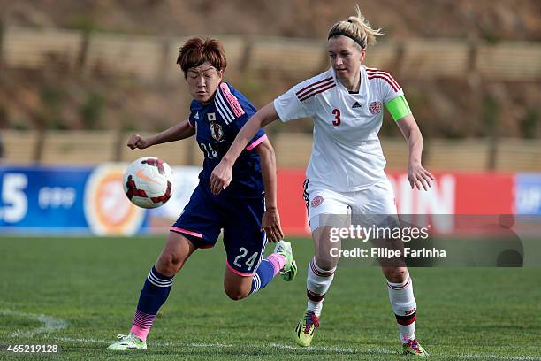 Yuika Sugasawa of Japan challenges Janni Arnth Jensen of Denmark during the Women's Algarve Cup match between Japan and Denmark on March 4, 2015 in...