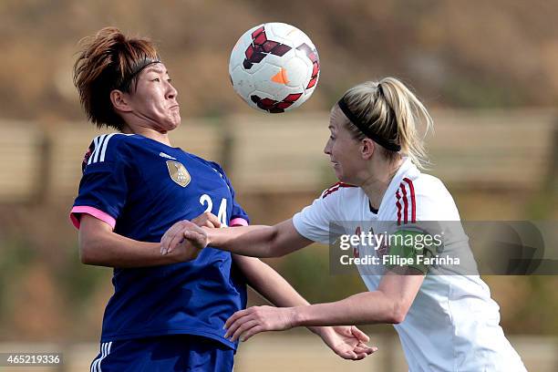 Yuika Sugasawa of Japan challenges Janni Arnth Jensen of Denmark during the Women's Algarve Cup match between Japan and Denmark on March 4, 2015 in...