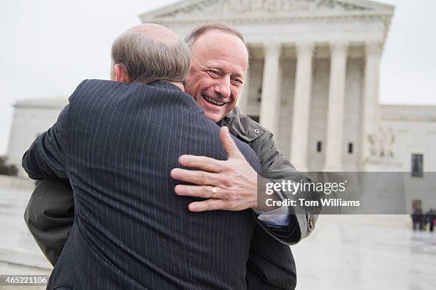 Rep. Steve King, R-Iowa, right, greets Rep. Louie Gohmert, R-Texas, during a rally outside of the Supreme Court during arguments in the King v....