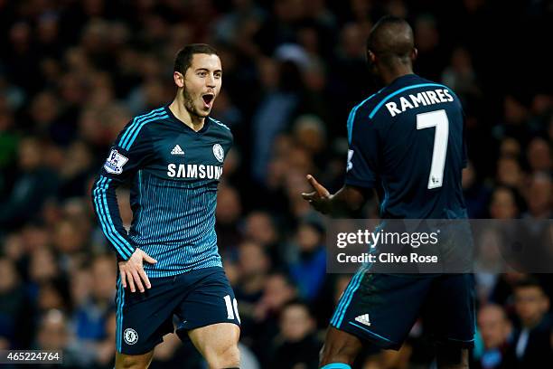 Eden Hazard of Chelsea celebrates with teammate Ramires of Chelsea after scoring the opening goal during the Barclays Premier League match between...