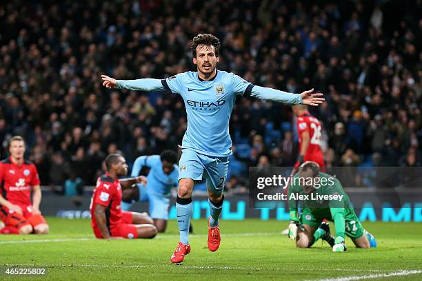 David Silva of Manchester City celebrates after scoring the opening goal during the Barclays Premier League match between Manchester City and...