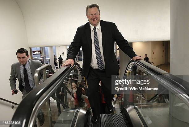 Sen. Jon Tester rushes to the Senate chamber to vote on an attempt to override U.S. President Barack Obama's veto of the Keystone XL Pipeline...