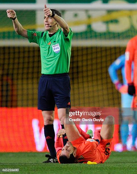 Sergio Busquets of FC Barcelona lies injured during the Copa del Rey Semi-Final, Second Leg match between Villarreal CF and Barcelona at El Madrigal...