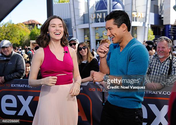 Megan Boone and Mario Lopez visit "Extra" at Universal Studios Hollywood on March 4, 2015 in Universal City, California.