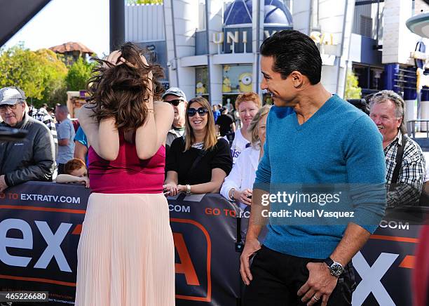 Megan Boone and Mario Lopez visit "Extra" at Universal Studios Hollywood on March 4, 2015 in Universal City, California.