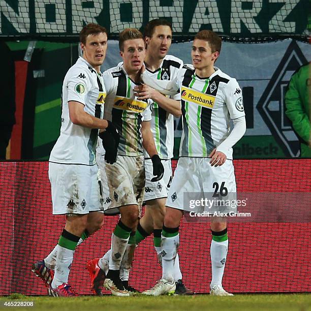 Patrick Herrmann of Moenchengladbach celebrates his team's second goal with team mates Max Kruse, Roel Brouwers and Thorgan Hazard during the DFB Cup...