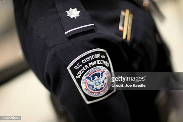 Customs and Border Protection officer's patch is seen as they unveil a new mobile app for international travelers arriving at Miami International...