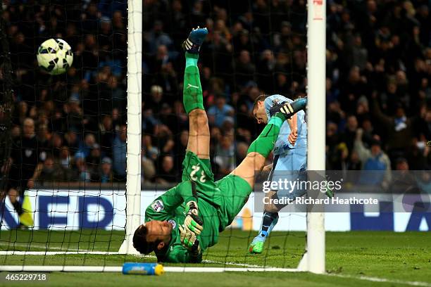 James Milner of Manchester City scores his team's second goal past goalkeeper Mark Schwarzer of Leicester City during the Barclays Premier League...