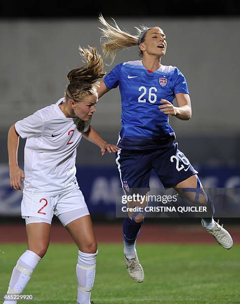 Norway's defender Marita S. Lund vies with US's defender Julie Johnston during the Algarve Cup football match Norway vs USA at the Estadio Municipal...