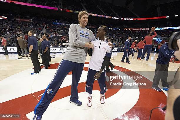 Dallas Mavericks Dirk Nowitzki shaking hands and posing with Atlanta Hawks Dennis Schroder before game at Philips Arena. Atlanta, GA 2/25/2015...