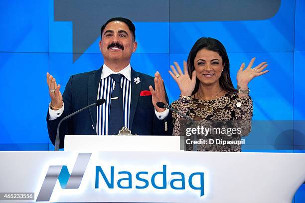 Reza Farahan and Golnesa "GG" Gharachedaghi of the "Shahs of Sunset" ring the NASDAQ Closing Bell at NASDAQ MarketSite on March 4, 2015 in New York...